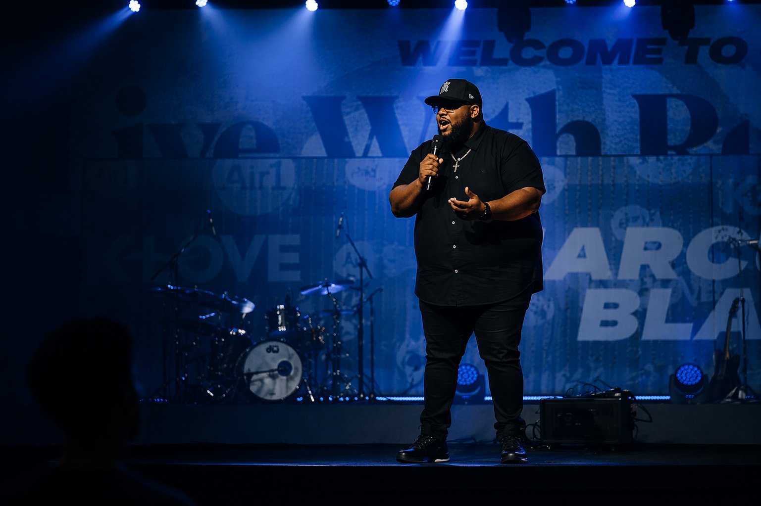 Marcus Black speaking on stage